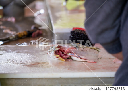 Leftover skin and guts from a fillet walleye fish Leftover skin and guts from a fillet walleye fish 127798218
