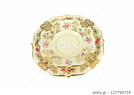 Set of Vintage plates of unusual shape with gold rim isolated on white. Set of Vintage plates of unusual shape with gold rim isolated on white. 127798734
