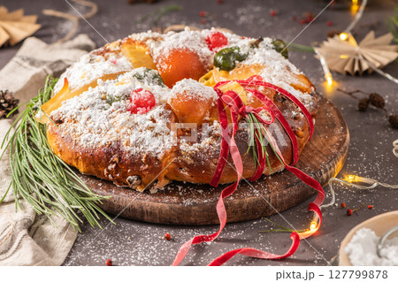 Bolo do Rei or King s Cake, Made for Christmas, Carnavale or Mardi Gras with Christmas season elements in Background. 127799878