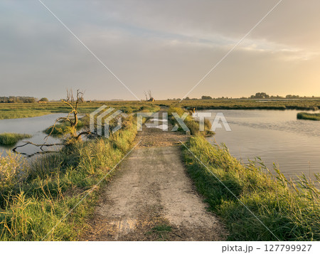 View of sunset on Ria de Aveiro, Ovar, Portugal. View of sunset on Ria de Aveiro, Ovar, Portugal. 127799927