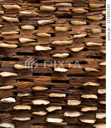 threshing board of aged wood and stones texture 127800150