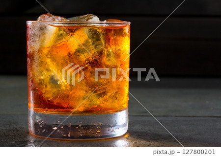 Whiskey whisky on the rocks on glass Whiskey whisky on the rocks on glass 127800201