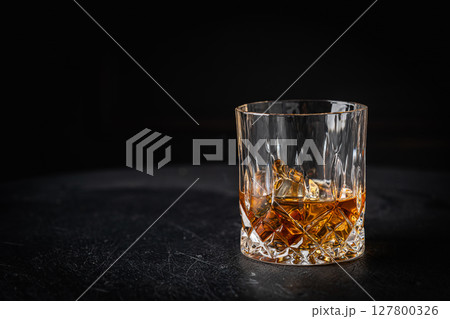 Whiskey with ice in glasses Whiskey with ice in glasses 127800326