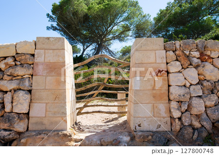 Menorca traditional wooden fence gate in Balearic islands 127800748