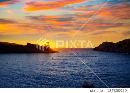 Menorca sunset in Cala Morell at Ses torretes beach Menorca sunset in Cala Morell at Ses torretes beach 127800920