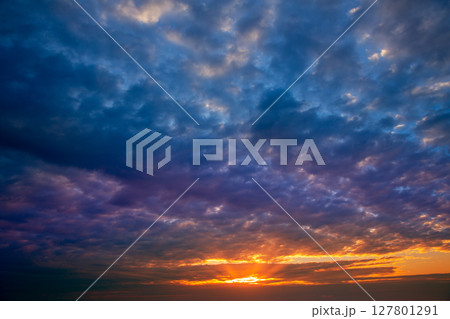 Dramatic sky with stormy clouds in sunset Dramatic sky with stormy clouds in sunset 127801291