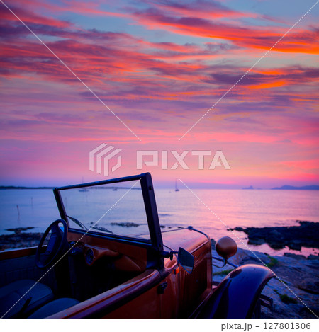 Ibiza sunset view from vintage car at Formentera 127801306