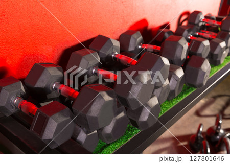 Dumbbells and Kettlebells weight training gym 127801646