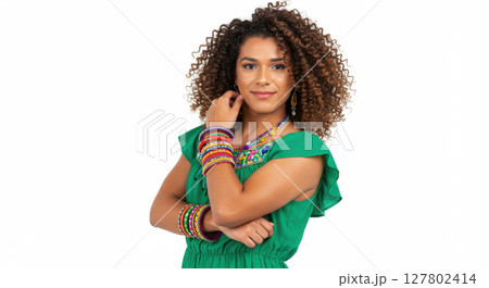 Confident Afro Latina Woman in Green Dress Posing with Colorful Bangles and Curly Hair 127802414