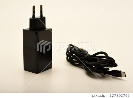 A new charger for gadgets with a wire. USB charging with a wire. 127802793