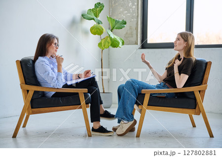 Mental therapy session, female professional psychologist working with young woman patient 127802881