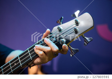 An Energetic and Enthralling Guitar Performance by Trendy Musicians on a Vibrant Stage An Energetic and Enthralling Guitar Performance by Trendy Musicians on a Vibrant Stage 127803591