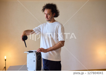 How To Effectively Clean a Portable Air Purifier Filter Utilizing a Vacuum Cleaning Tool 127804041