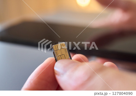 Detailed Process of Installing a SIM Card Utilizing Various Smartphone Components and Accessories Detailed Process of Installing a SIM Card Utilizing Various Smartphone Components and Accessories 127804090