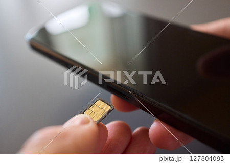 Detailed Process of Installing a SIM Card Utilizing Various Smartphone Components and Accessories Detailed Process of Installing a SIM Card Utilizing Various Smartphone Components and Accessories 127804093