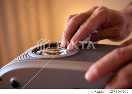 It is important to clean a projector lens carefully using a microfiber cloth for best results 127804103