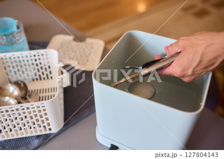 Kitchen Tools and Equipment Arranged Neatly in a Basket for Easy Access and Organization Kitchen Tools and Equipment Arranged Neatly in a Basket for Easy Access and Organization 127804143