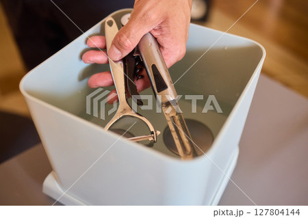 Kitchen Tools and Equipment Arranged Neatly in a Basket for Easy Access and Organization Kitchen Tools and Equipment Arranged Neatly in a Basket for Easy Access and Organization 127804144