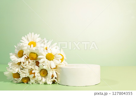 Empty podium with beautiful flowers of garden chamomile and mallow.Abstract flower arrangement,banner.Creative template for your design.Minimal modern aesthetics, elegant beauty concept Empty podium with beautiful flowers of garden chamomile and mallow.Abstract flower arrangement,banner.Creative template for your design.Minimal modern aesthetics, elegant beauty concept 127804355