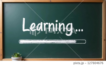 Chalkboard with loading bar and Learning... text, creative symbol of back to school and new academic year start. 127804676