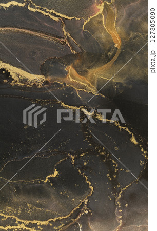 Swirling patterns of alcohol ink create a beautiful abstract art piece with golden accents Swirling patterns of alcohol ink create a beautiful abstract art piece with golden accents 127805090