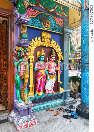 Ornate temple entrance with colorful Hindu deity statues at the Batu Caves in Kuala Lumpur, Malaysia 127807002