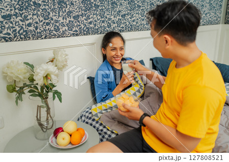 Cozy Morning Moments Sharing Delicious Fruits and Joyful Smiles Together 127808521