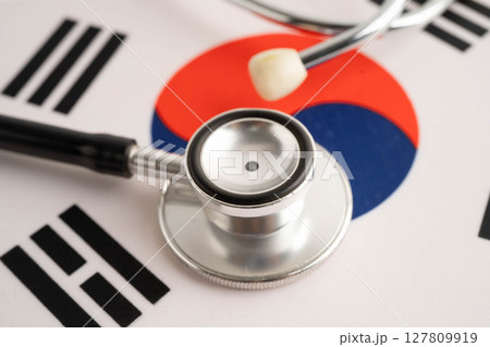 South Korea flag with black stethoscope, Business and finance concept. South Korea flag with black stethoscope, Business and finance concept. 127809919