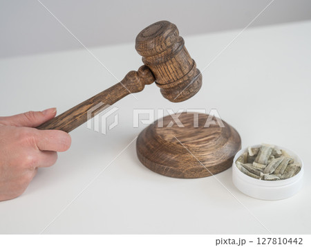 Judge Bangs Gavel. Chewing Tobacco Ban. Judge Bangs Gavel. Chewing Tobacco Ban. 127810442