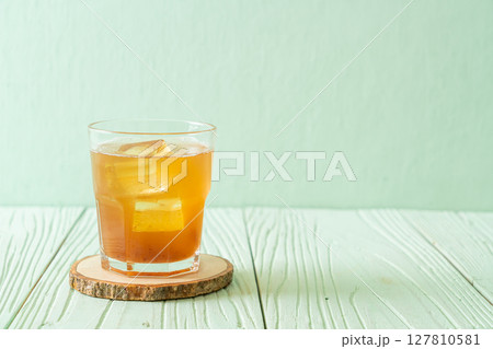 Delicious sweet drink tamarind juice and ice cube Delicious sweet drink tamarind juice and ice cube 127810581