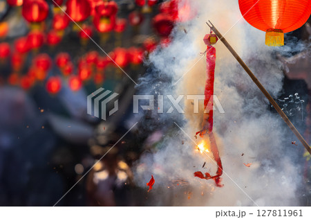 Traditional Chinese firecrackers are exploding with flashes and smoke in Lunar new year. Traditional Chinese firecrackers are exploding with flashes and smoke in Lunar new year. 127811961