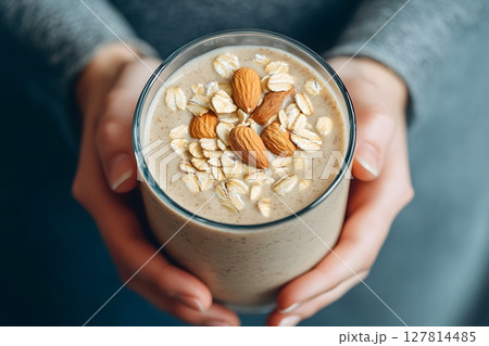 3D young person holding protein shake with almond milk and oats 3D young person holding protein shake with almond milk and oats 127814485