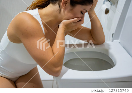 Caucasian woman suffers from toxicosis.  127815749