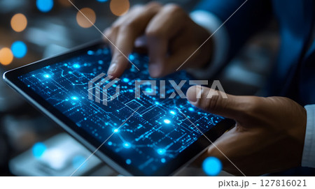 factory manager analyzing IoT sensor data via tablet 127816021