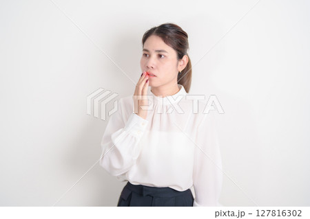 Business woman having Mouth ache for concepts of Mouth Ulcer Sore, Aphthous Stomatitis, Oral Lesions, Halitosis, Oral Health Care, Toothache and Gum Disease, Dental Caries, Gingivitis and  Periodontal 127816302