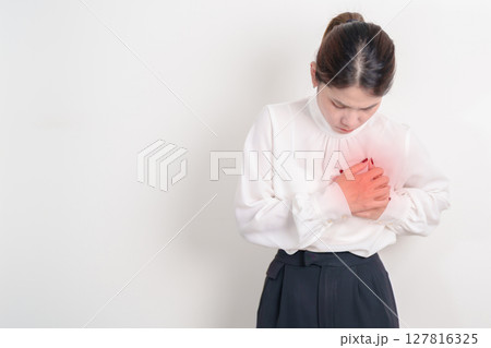 Business Woman having chest pain for Heart disease, angina disease and symptom heart attack disease Cardiovascular, Atherosclerosis, Hypertensive, Breast Cancer awareness, world Heart day and Health Business Woman having chest pain for Heart disease, angina disease and symptom heart attack disease Cardiovascular, Atherosclerosis, Hypertensive, Breast Cancer awareness, world Heart day and Health 127816325
