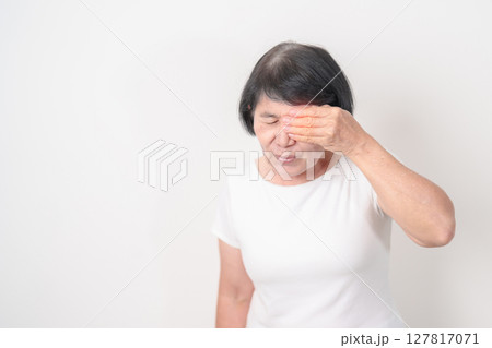 Elderly Woman having Eye pain and Irritation for concepts of Eye disease, Cataract, Glaucoma, Age Related Macular Degeneration, Diabetic Retinopathy, dry eyes, Conjunctivitis, World Glaucoma day 127817071