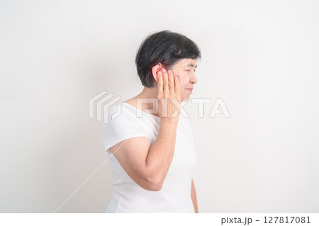 Elderly Woman having Ear pain for concept of Ear disease, Atresia, Otitis Media, Infection, Pertorated Eardrum, Meniere syndrome, Otolaryngologist, Hearing Loss, Hyperacusis, Tinnitus and Earwax 127817081