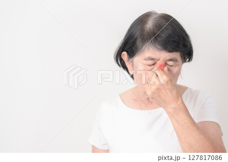 Elderly Woman having Nose pain for concepts of Nose disease, Common Cold, Influenza, Flu, Covid 19, Respiratory Infection, Sinusitis, Allergic Rhinitis, Asthma, Allergy, Dry nose Anosmia and Health Elderly Woman having Nose pain for concepts of Nose disease, Common Cold, Influenza, Flu, Covid 19, Respiratory Infection, Sinusitis, Allergic Rhinitis, Asthma, Allergy, Dry nose Anosmia and Health 127817086