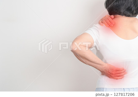 Elderly woman having back body ache for concepts of Back Muscle Strain, Piriformis Syndrome, Low Back Pain, Lumbar Disc Degeneration, Herniated, Osteoporosis, Spinal Compression and Health care Elderly woman having back body ache for concepts of Back Muscle Strain, Piriformis Syndrome, Low Back Pain, Lumbar Disc Degeneration, Herniated, Osteoporosis, Spinal Compression and Health care 127817206