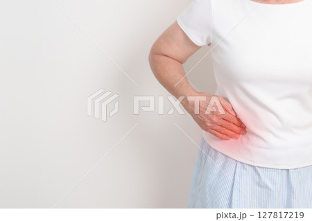 Elderly woman having side and Back Waist pain for Kidney disease, Urinary system and Stones, world Kidney and Cancer day, Chronic kidney, Organ Donor Day and Health care concept 127817219