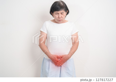 Elderly Woman having abdomen pain for Ovarian, Uterine and Cervical awareness month cancer, Cervix disorder, Endometriosis, Hysterectomy, Uterine fibroids, Reproductive system and women health concept 127817227