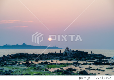 Spring Sunset Crowd at Fugui Cape Lighthouse in Shimen, New Taipei City, Taiwan. Spring Sunset Crowd at Fugui Cape Lighthouse in Shimen, New Taipei City, Taiwan. 127817492