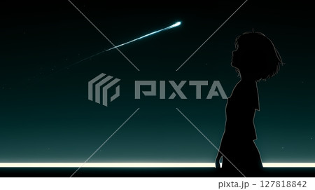 火球：星空を眺めている若い女性