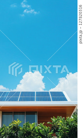 Installing solar panels on a modern house roof, harnessing sunlight for clean energy against a backdrop of blue sky and clouds, promotes sustainable living 127820316