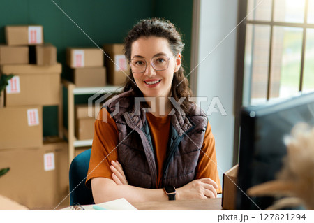 Woman working in a warehouse 127821294