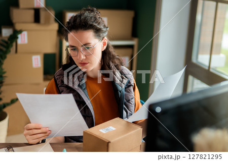Woman working in a warehouse Woman working in a warehouse 127821295
