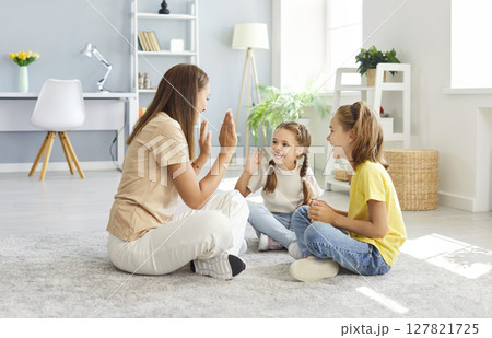 Mother Playing With Children Together At Home Mother Playing With Children Together At Home 127821725