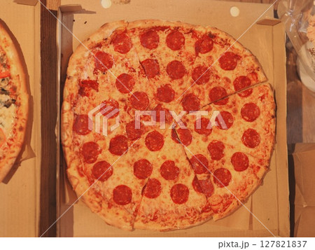 A mouthwatering Pepperoni Pizza is freshly prepared and ready for you to enjoy and serve 127821837
