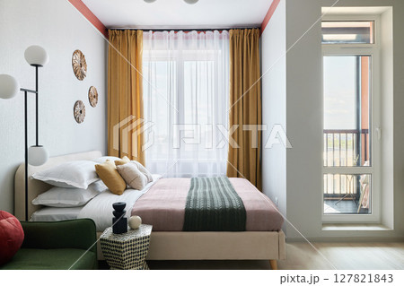 Stylish Modern Bedroom Featuring a Cozy Aesthetic and an Abundance of Natural Light Stylish Modern Bedroom Featuring a Cozy Aesthetic and an Abundance of Natural Light 127821843